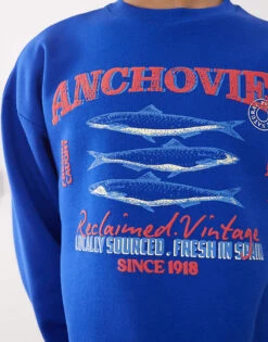 Reclaimed Vintage Unisex Cropped Boxy Sweatshirt With Fisherman Print In Blue For Unisex -Closet Theory Her 208170665 4