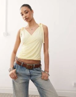 Reclaimed Vintage Wrap Front Tank Top With Bow Shoulder In Buttermilk Yellow For Women -Closet Theory Her 208516797 1 buttermilkyellow 1